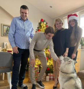 Borna Sosa celebrating Christmas with his family and his huskey.