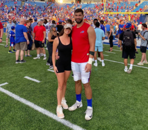 NFL star AJ Epenesa with her girlfriend Mary Marusza at Highmark Stadium