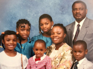 Young Maurice Edu with his parents and siblings.