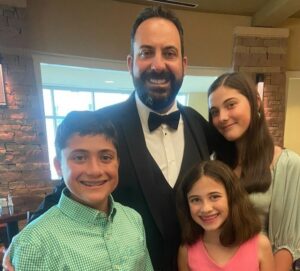 John Papuchis with his children