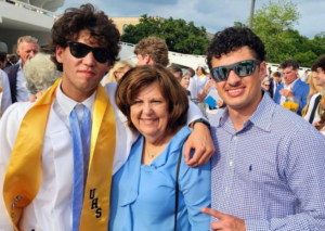 Cameron Robbins posing beside his family members on his high school graduation day (21 May).