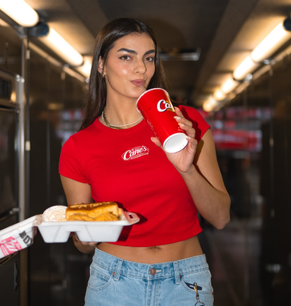 Toni Breidinger Turns Heads in Kansas with Bold Tank Top and Jorts Look